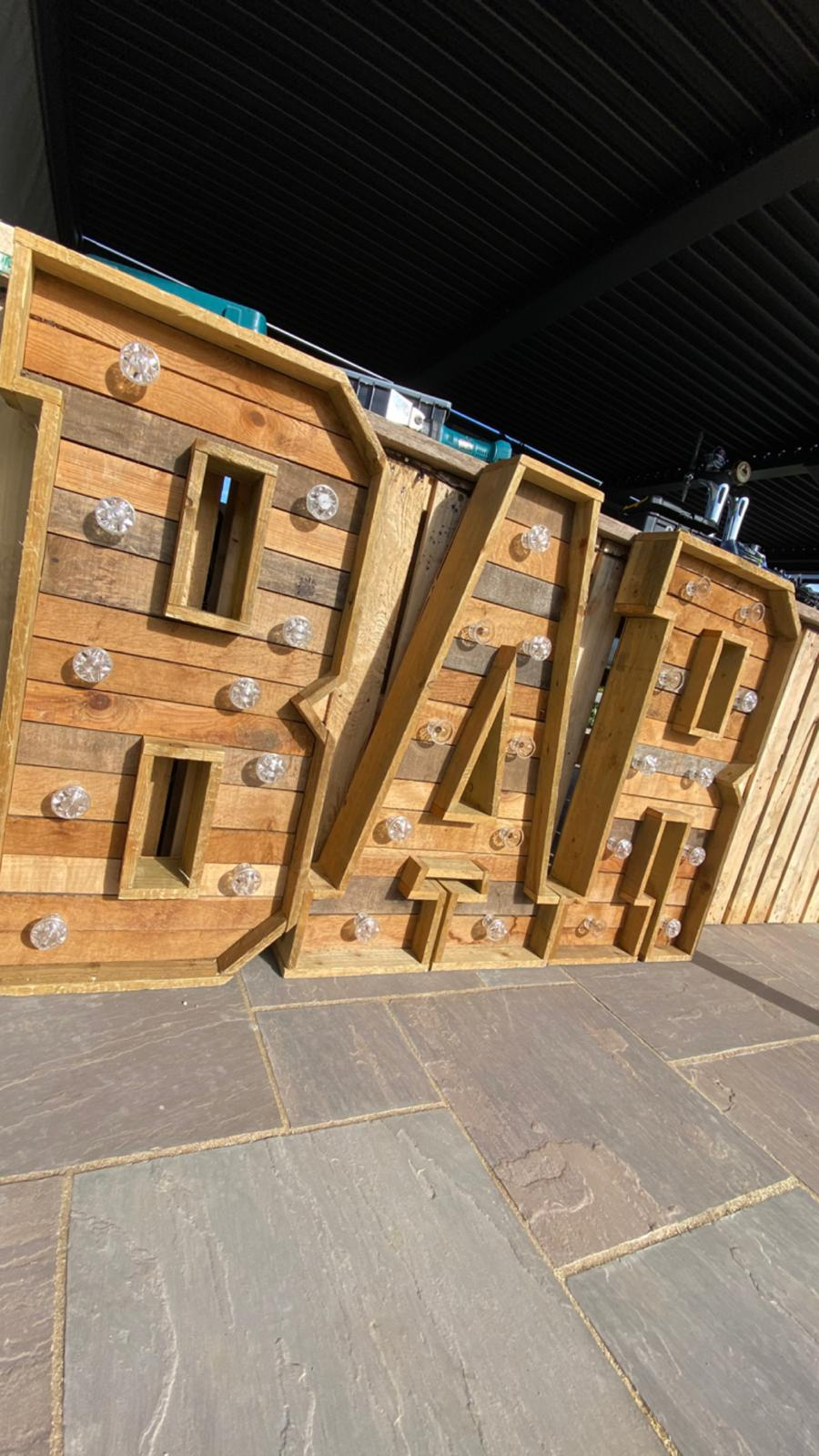 Reclaimed timber BAR marquee letters with glass bulb detail from our hire catalogue