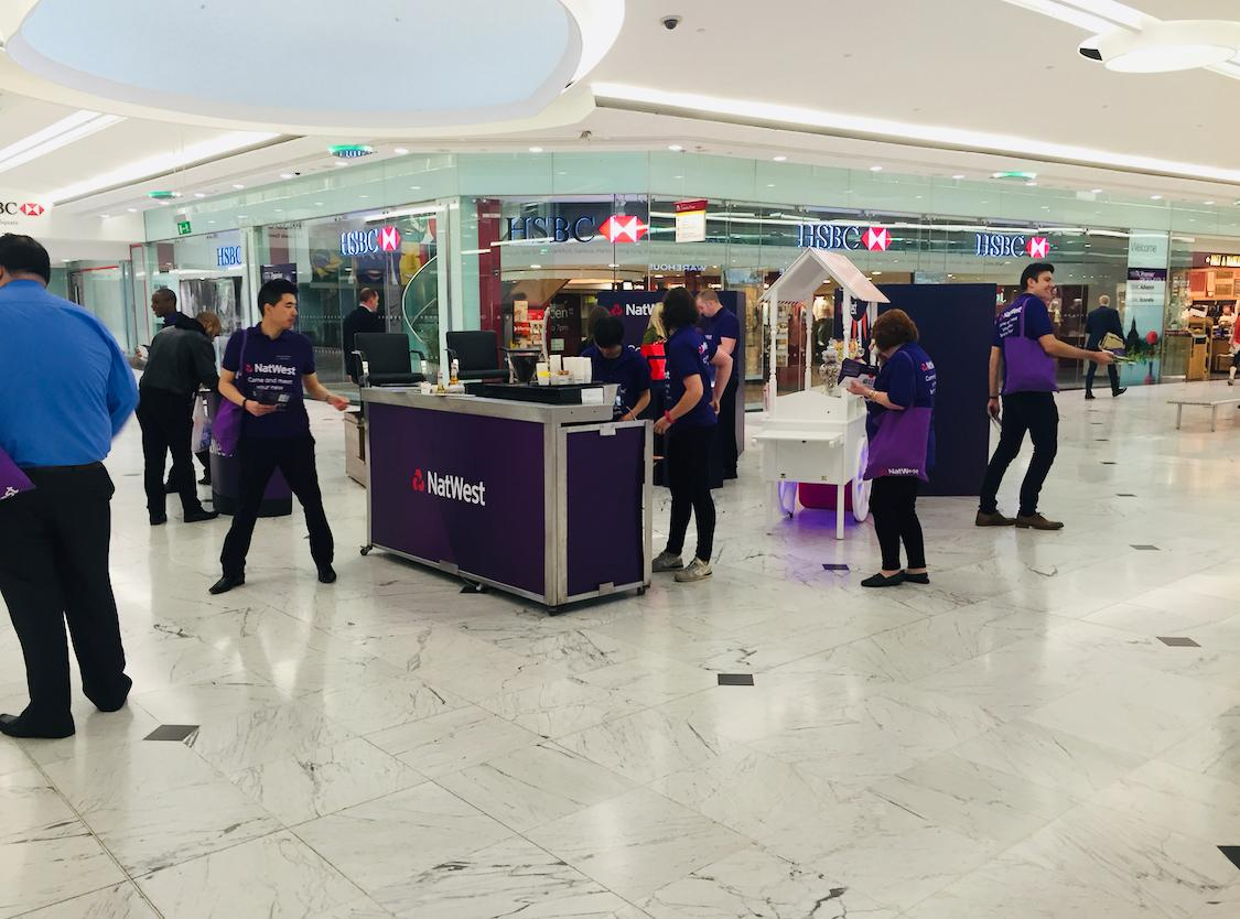 NatWest coffee activation in a shopping centre with branded bar, barista service and promotional staff