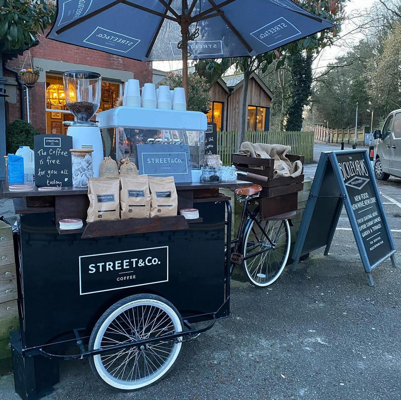 Street and Co branded coffee bike set up outside a venue for guest service