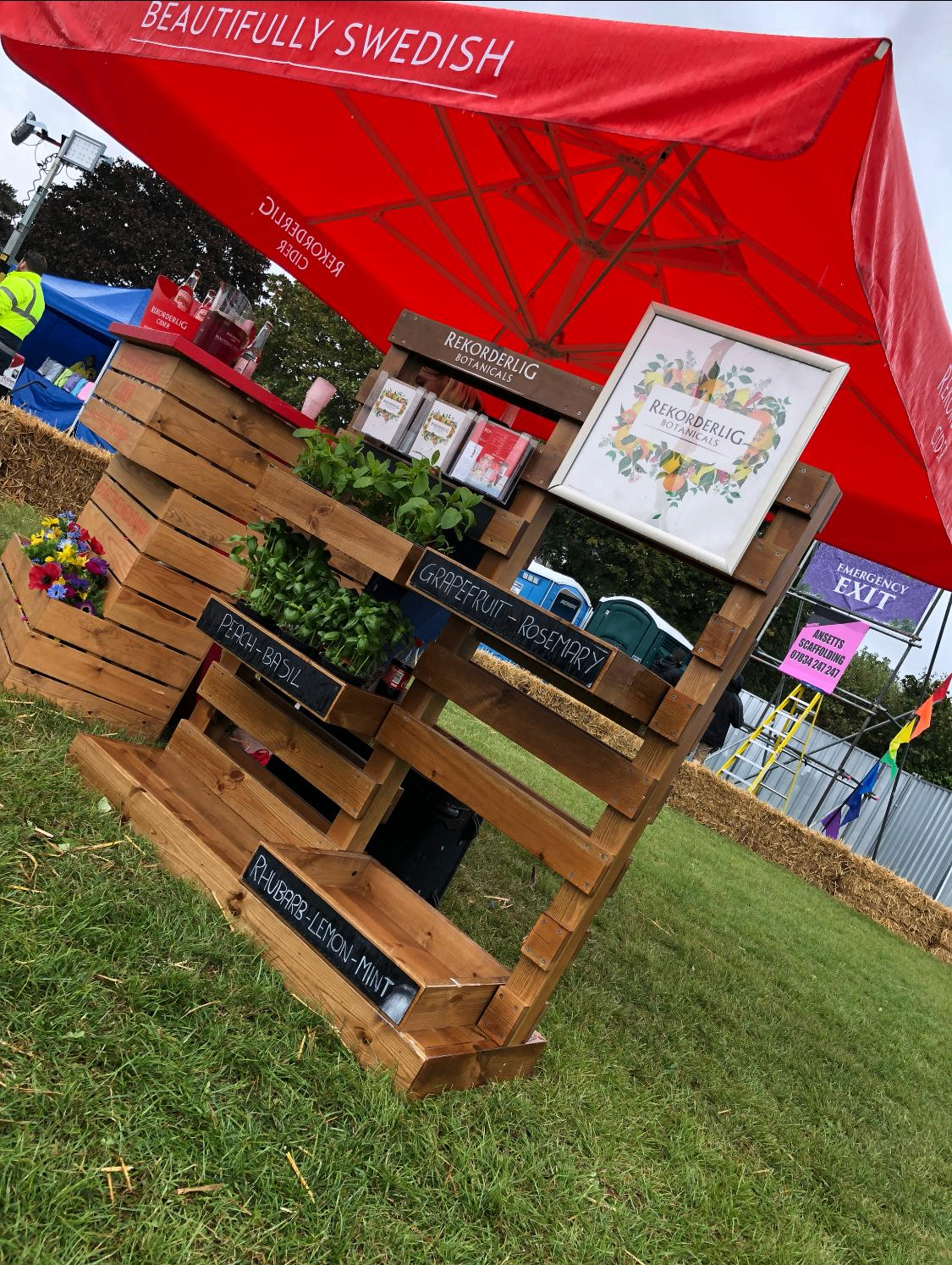 Rekorderlig Botanicals pallet bar with fresh herbs at a festival sampling activation