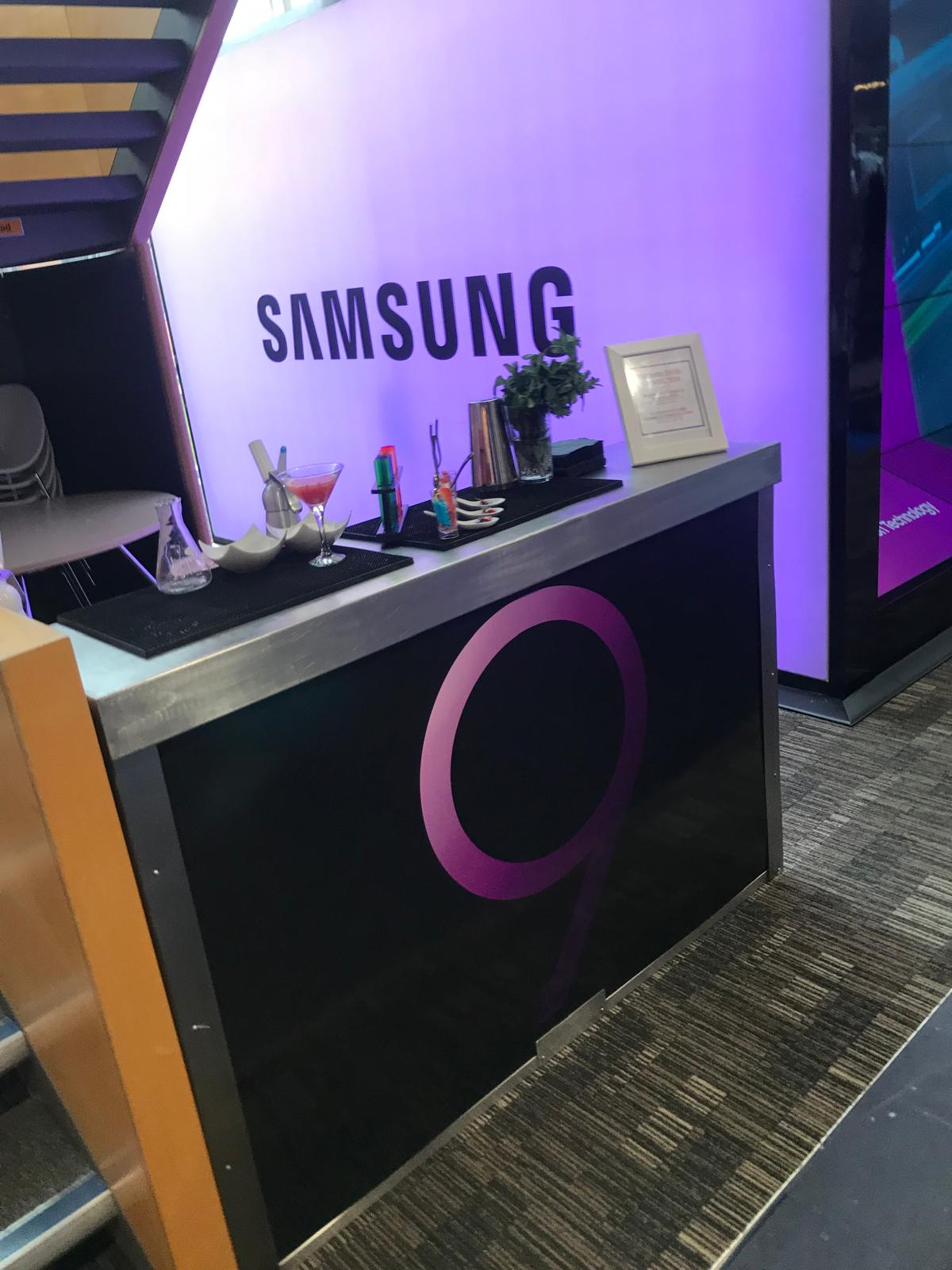 Samsung branded mobile cocktail station with illuminated backdrop at a product launch exhibition