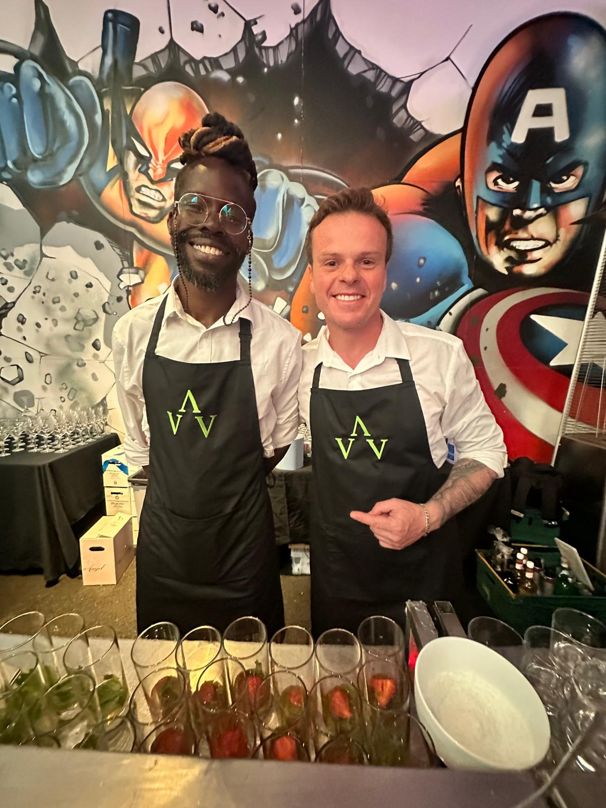 Bartender team standing behind the bar at a private event