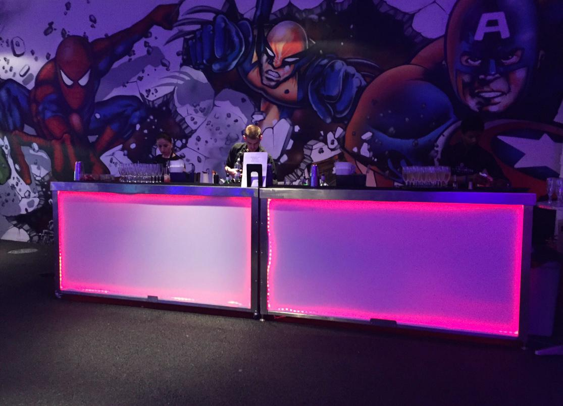 LED mobile bar setup at a themed private event with comic artwork backdrop