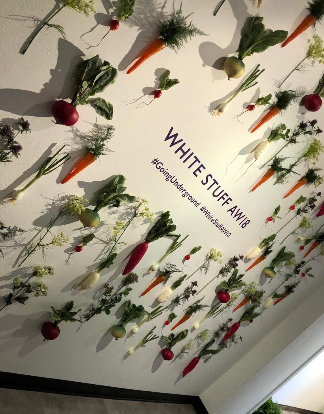 White Stuff AW18 #GoingUnderground branded installation wall with hanging vegetables and herbs