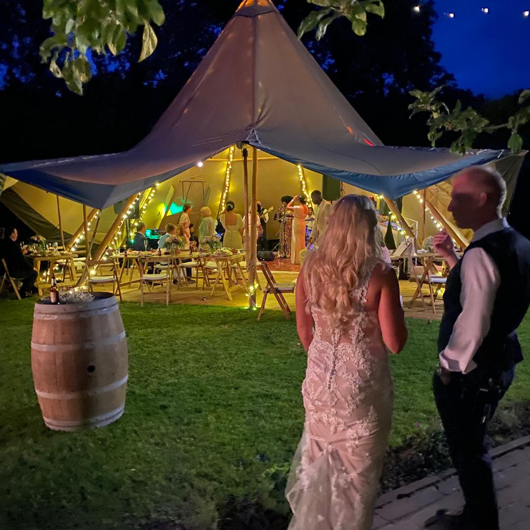 Bespoke wedding bar inside a candle-lit tipi at a North West countryside wedding
