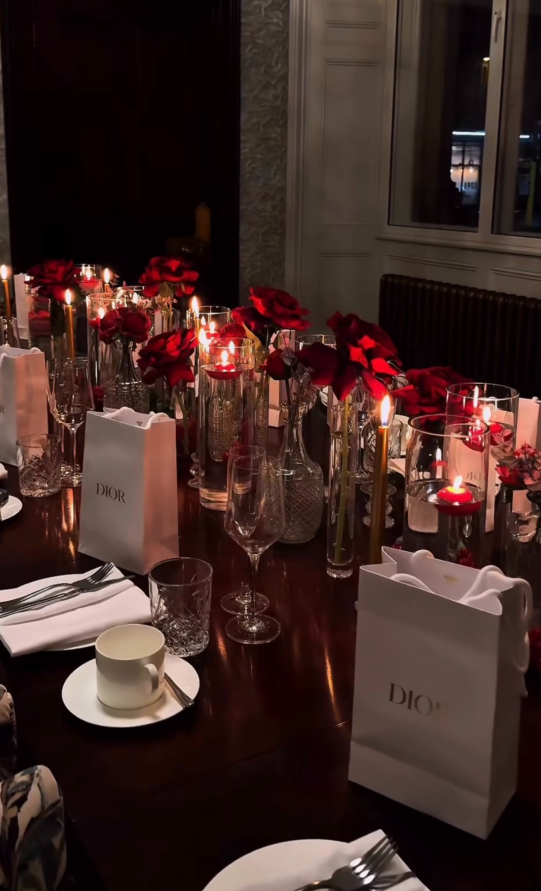 Shelly's Inspired Events table styling with red roses, taper candles and crystal glassware