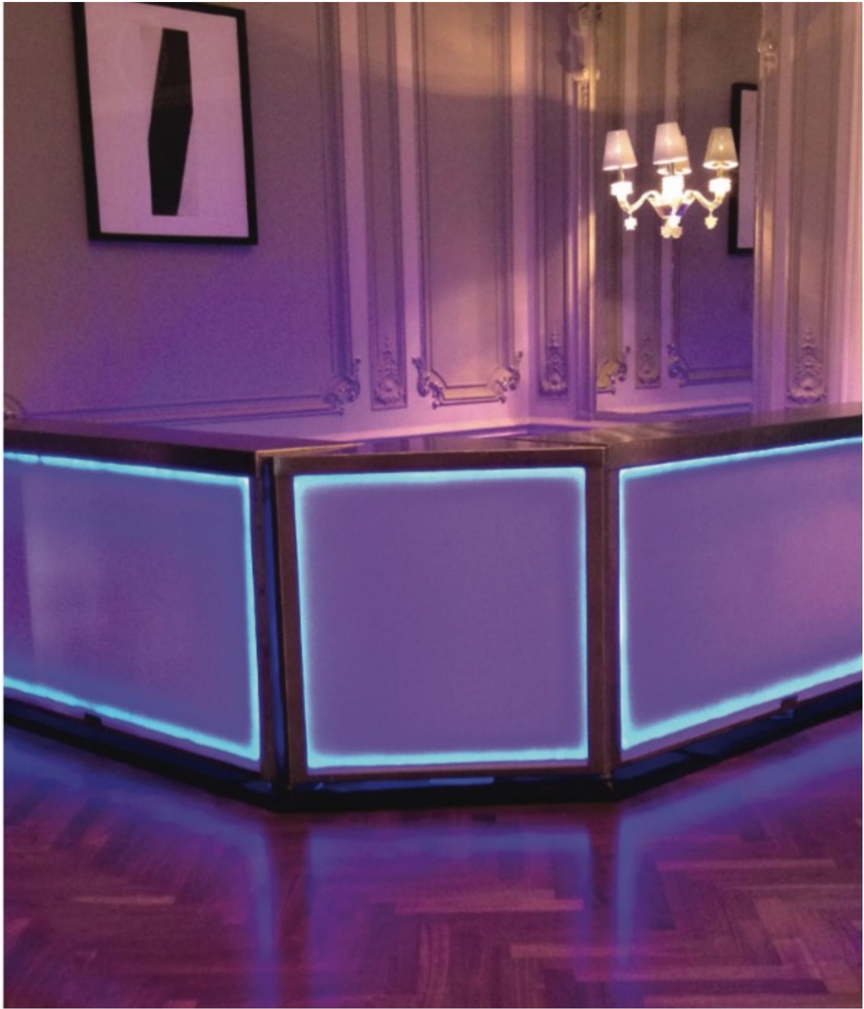 Purple-lit mobile bar from our fleet set up for a private event